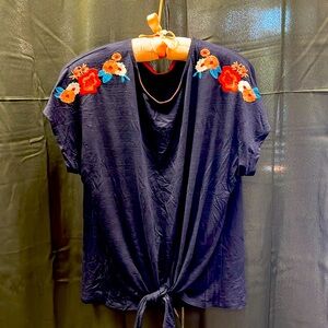 Summer light blouse with embroidery. Elegant knot at bottom